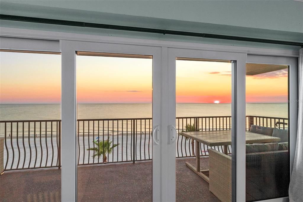 13650 Gulf Boulevard, Unit 604 Madeira Beach, FL 33708 - Photo 19 of 71 a view of a porch with a floor to ceiling window