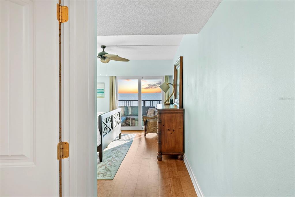 13650 Gulf Boulevard, Unit 604 Madeira Beach, FL 33708 - Photo 29 of 71 a living room with furniture and a floor to ceiling window