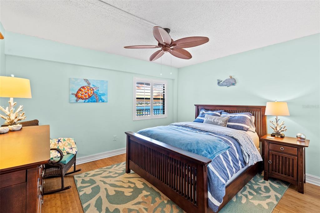 13650 Gulf Boulevard, Unit 604 Madeira Beach, FL 33708 - Photo 39 of 71 a bedroom with bed and a window