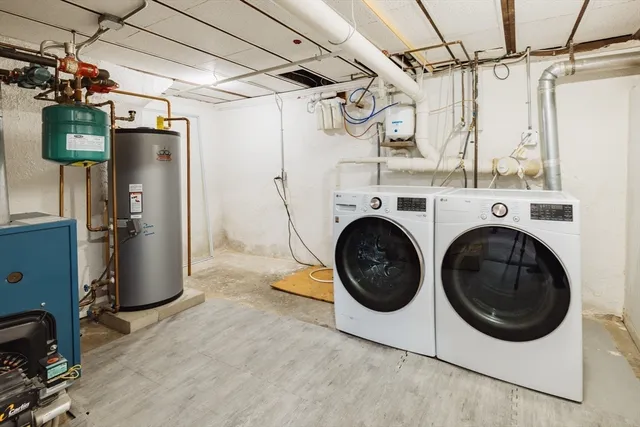 a view of a storage & utility room with washer and dryer