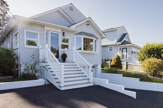 a front view of a house with a porch