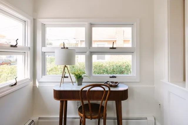 a view of a dining room with furniture window and outside view