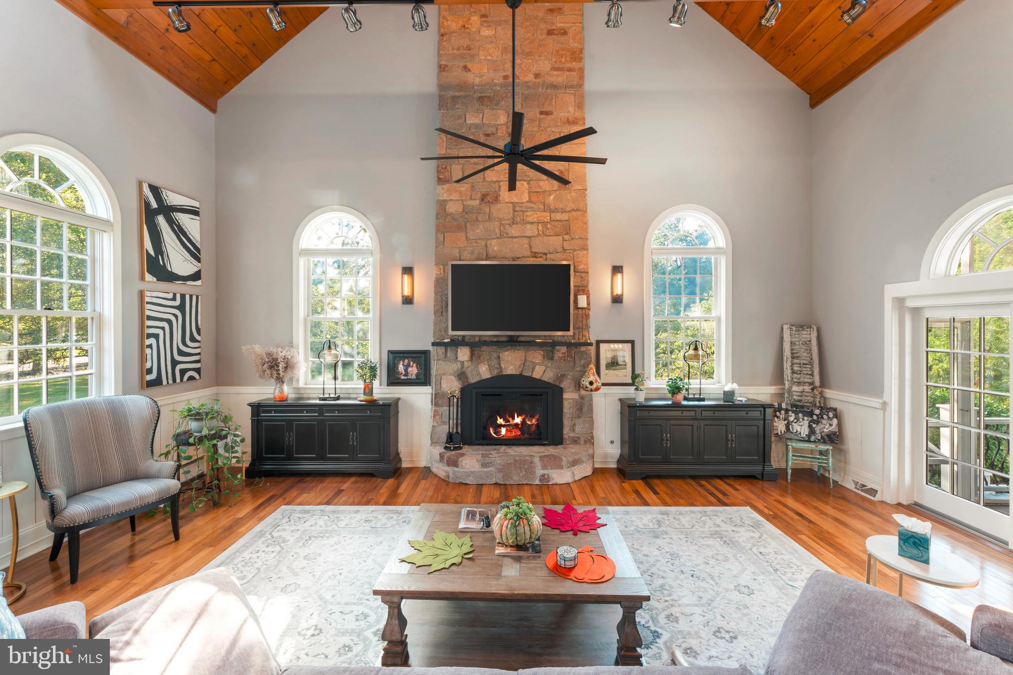 910 Old Dolington Road Newtown, PA 18940 - Photo 11 of 84 a living room with furniture fireplace and flat screen tv