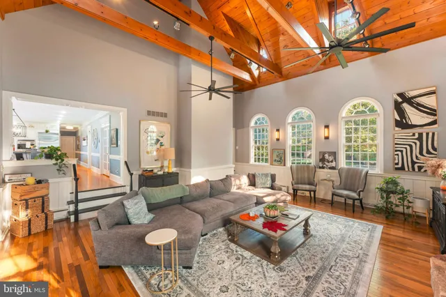 a large kitchen with stainless steel appliances granite countertop a lot of counter space and a sink