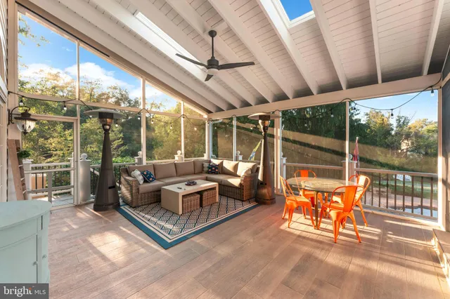 a view of a balcony with wooden floor and fence