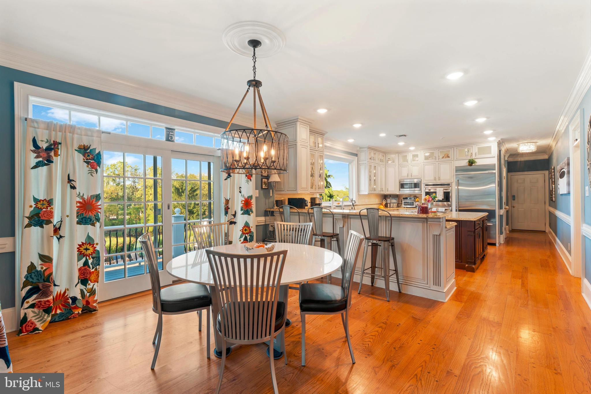 910 Old Dolington Road Newtown, PA 18940 - Photo 17 of 84 a dining room with furniture a chandelier and wooden floor
