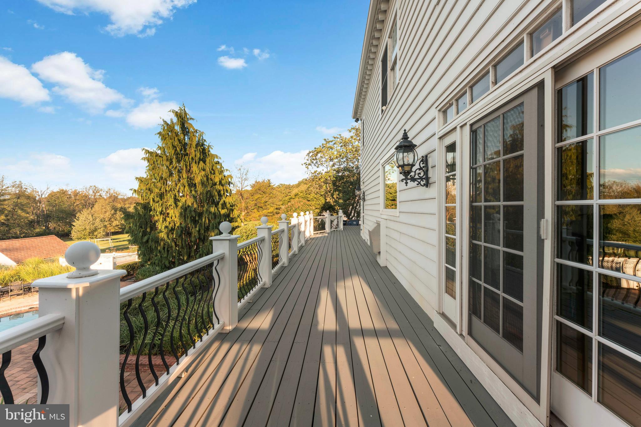 910 Old Dolington Road Newtown, PA 18940 - Photo 22 of 84 a view of a balcony with wooden floor and fence