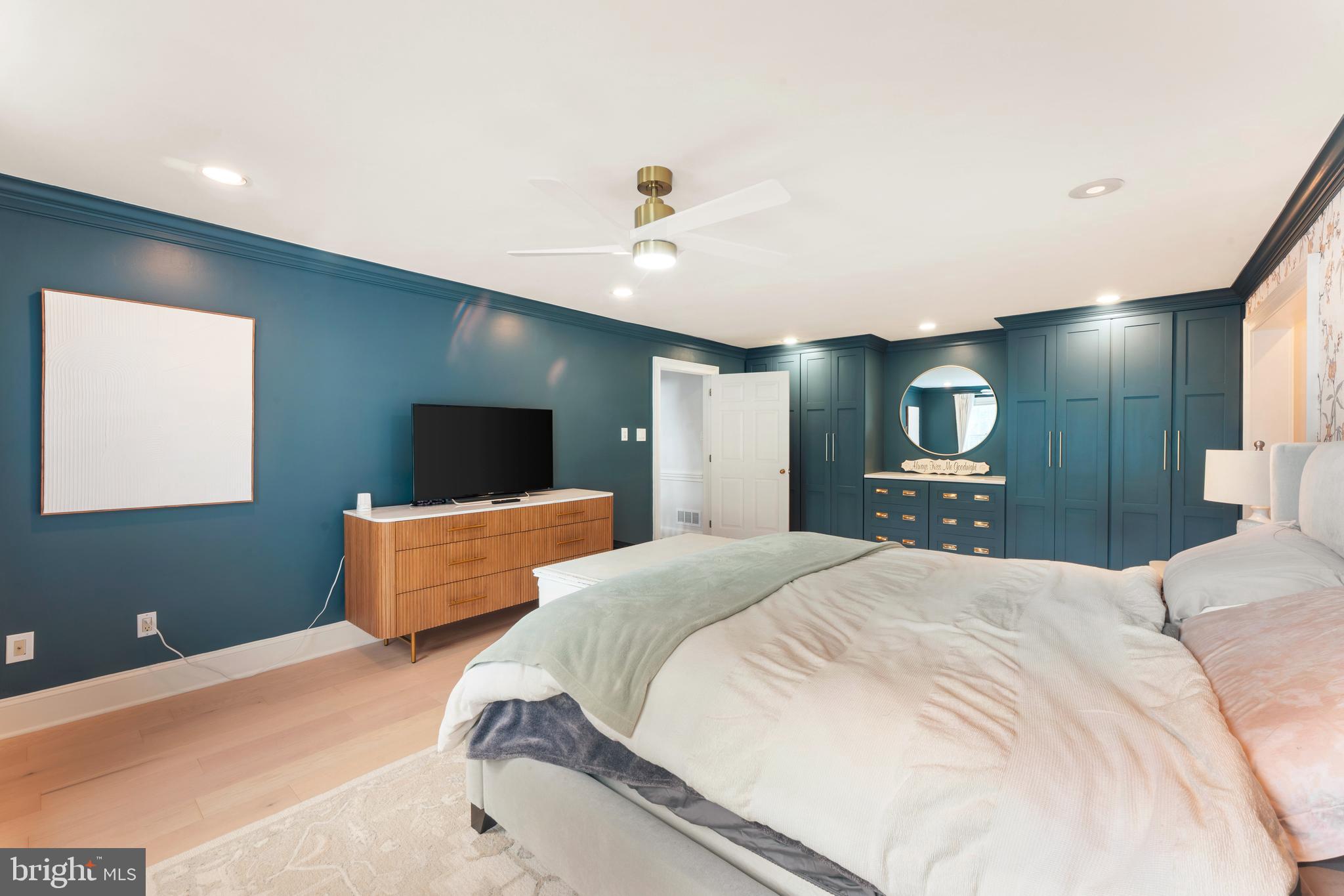 910 Old Dolington Road Newtown, PA 18940 - Photo 27 of 84 a spacious bedroom with a bed and a flat screen tv