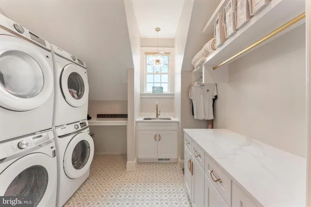 a kitchen with stainless steel appliances a refrigerator sink and stove
