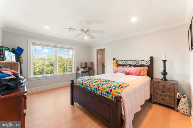 a living room with furniture large window and a fireplace