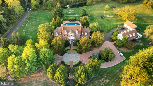 a living room with furniture a rug and a chandelier