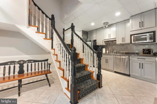 a bedroom with a bed and a ceiling fan