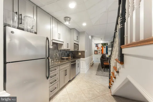 a bathroom with a toilet a sink and a mirror