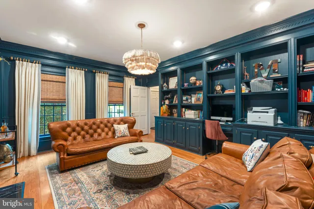 a view of a dining room with furniture wooden floor and chandelier