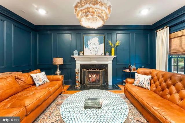 a living room with furniture fireplace and a flat screen tv