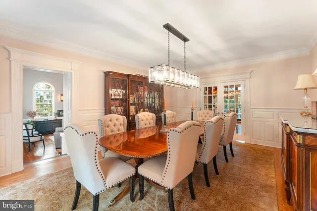 a living room with fireplace furniture and a large window