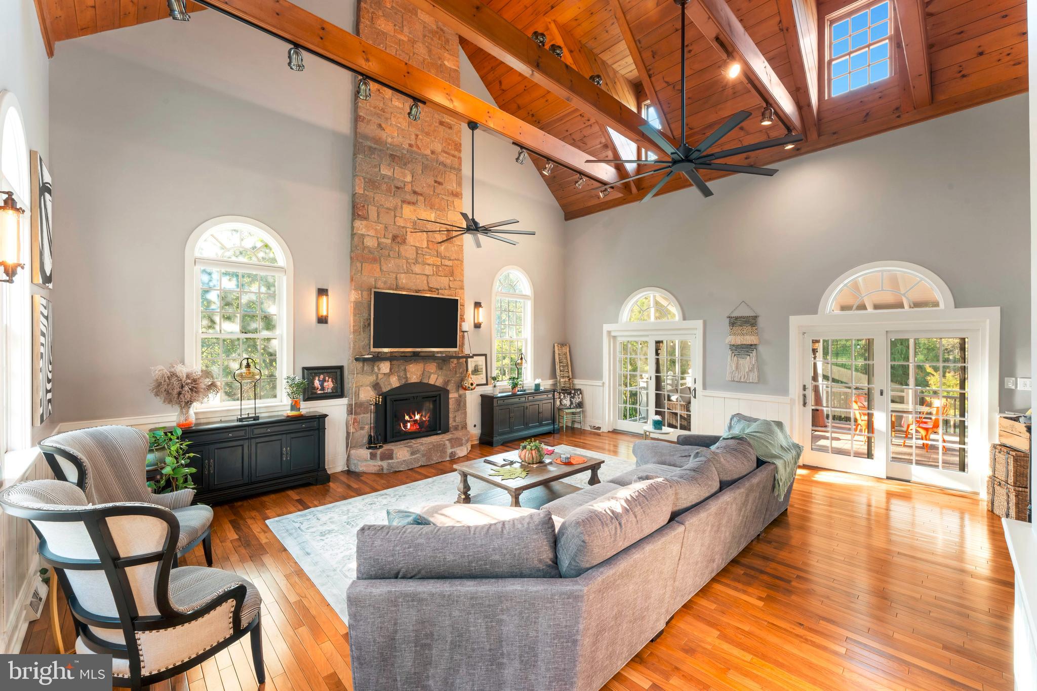 910 Old Dolington Road Newtown, PA 18940 - Photo 10 of 84 a living room with furniture fireplace and a flat screen tv