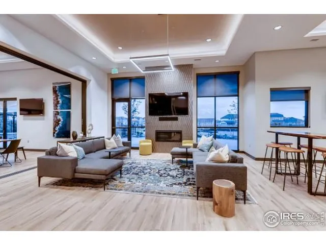 a living room with fireplace furniture and a flat screen tv