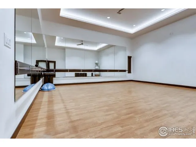 a kitchen with stainless steel appliances granite countertop a stove and a refrigerator