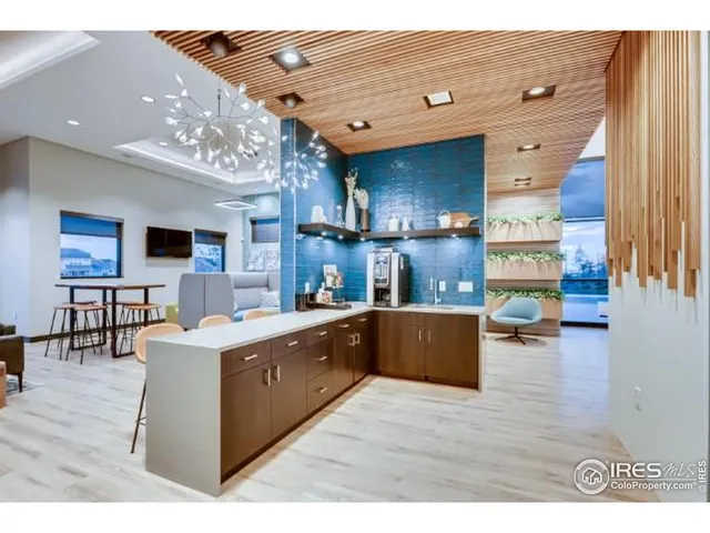 a view of kitchen with stainless steel appliances granite countertop lots of counter top space