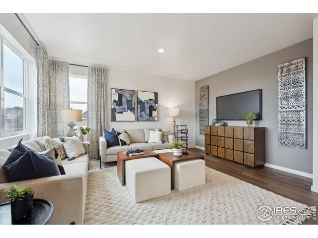 a living room with furniture window and flat screen tv