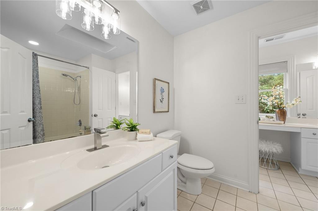 2804 County Clare Road Greensboro, NC 27407 - Photo 32 of 50 Full Bathroom connected to hallway and additional double vanities