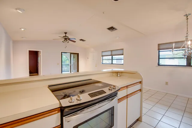 a kitchen with a stove and a sink