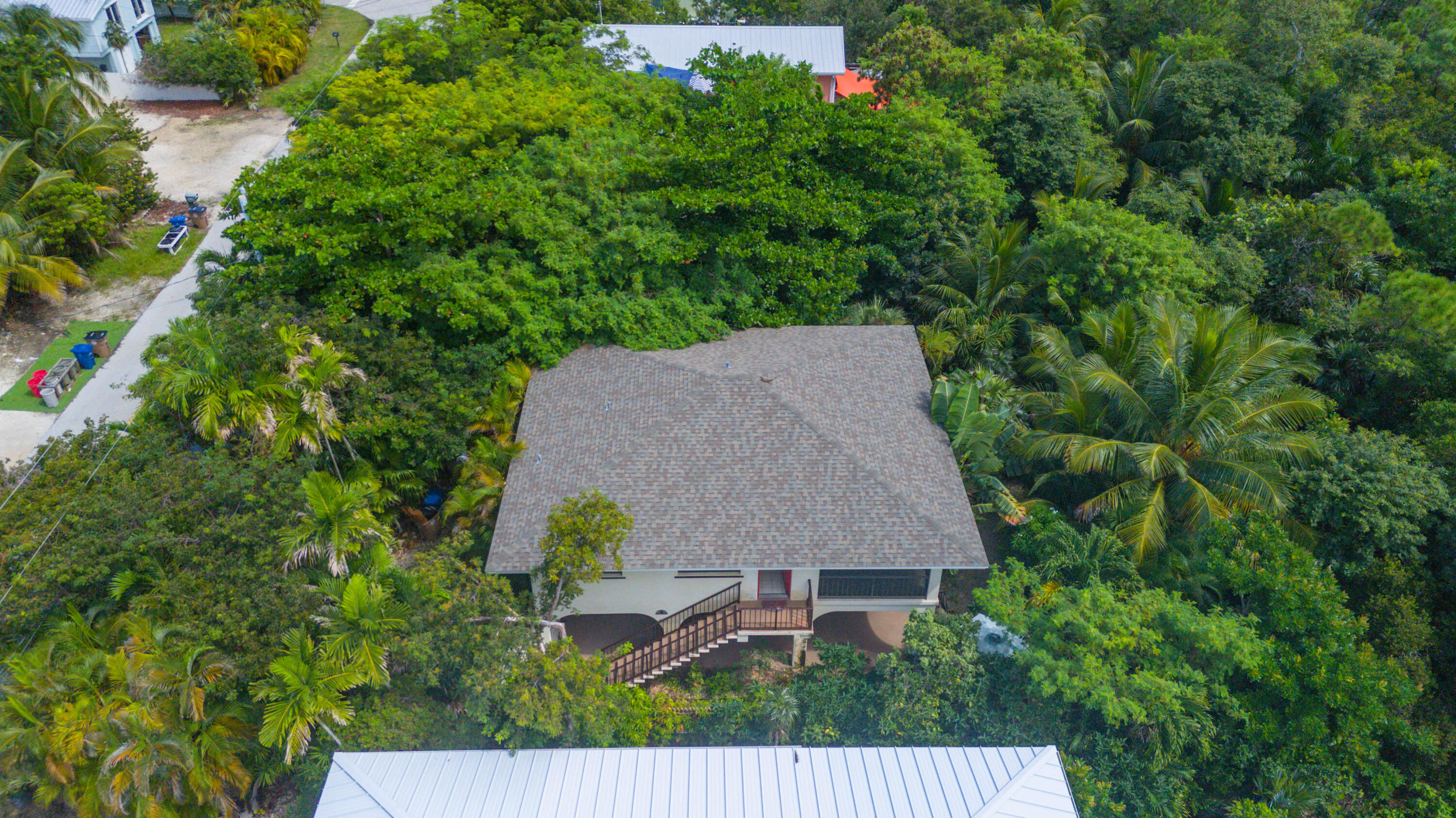 29850 Journeys End Road Big Pine Key, FL 33043 - Photo 9 of 32 an aerial view of a house with yard and outdoor seating