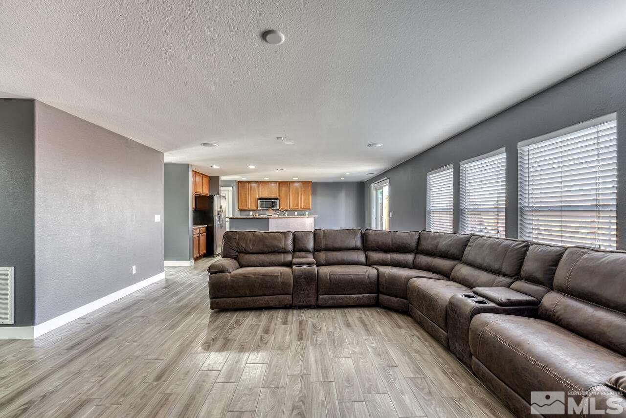 8935 Convair Way Reno, NV 89506 - Photo 11 of 39 a living room with furniture and a hard wood floor