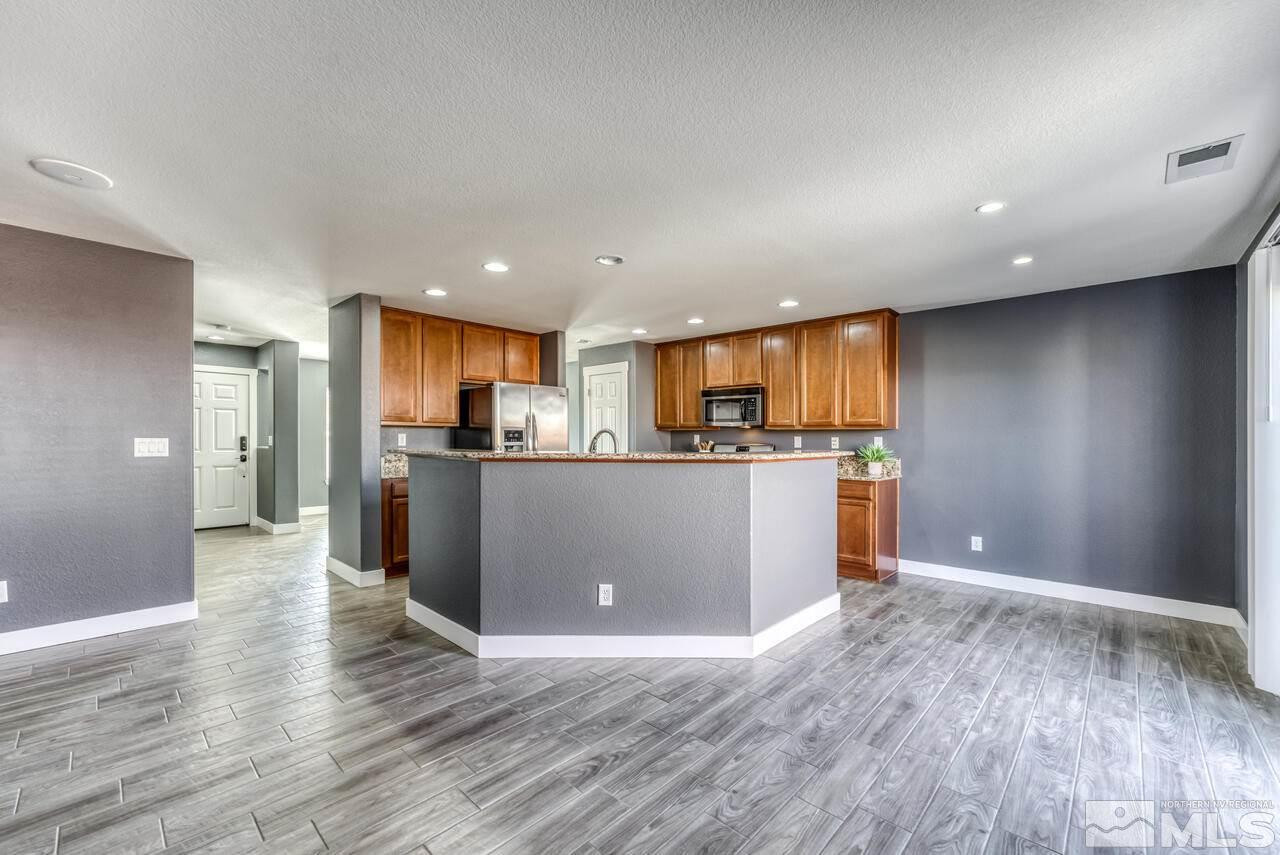 8935 Convair Way Reno, NV 89506 - Photo 13 of 39 a view of kitchen with kitchen island and stainless steel appliances