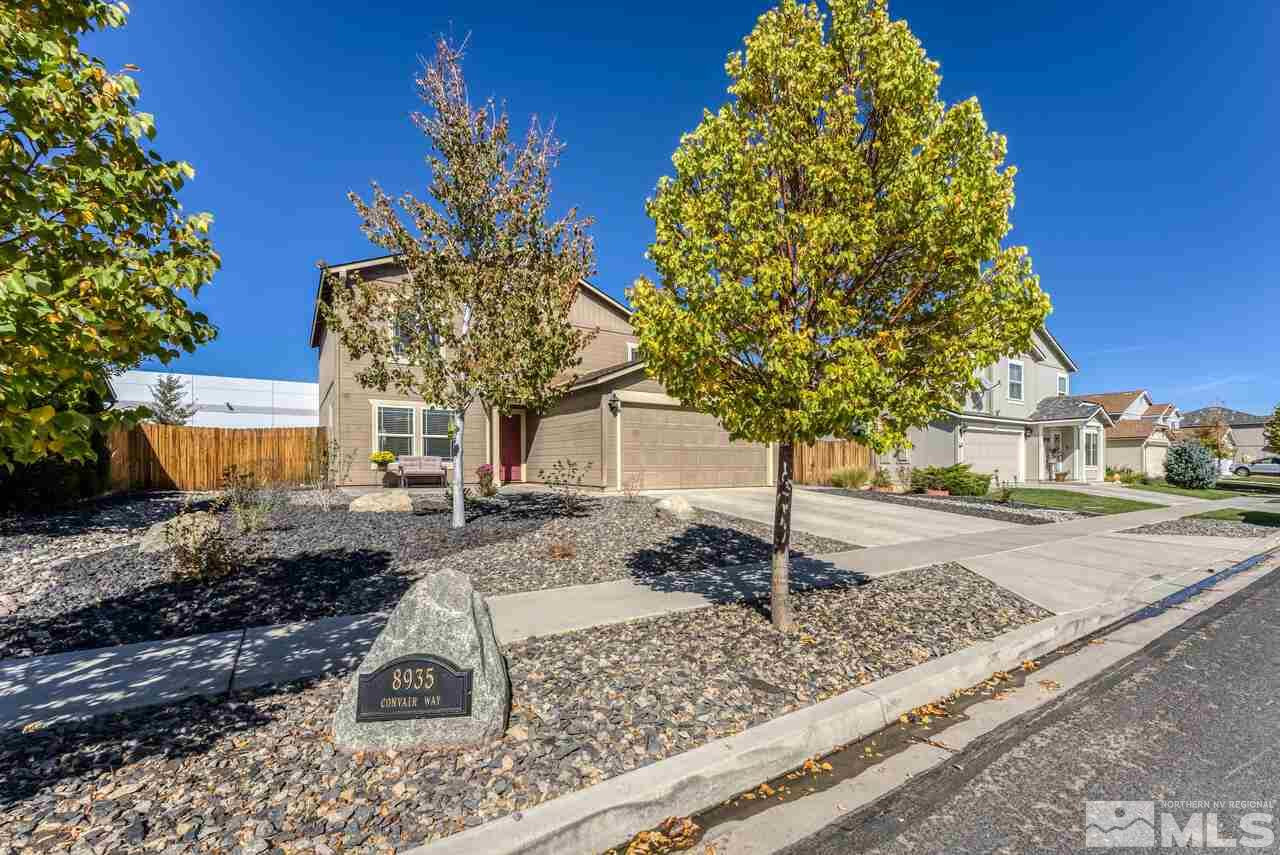 8935 Convair Way Reno, NV 89506 - Photo 2 of 39 a front view of a house with garden