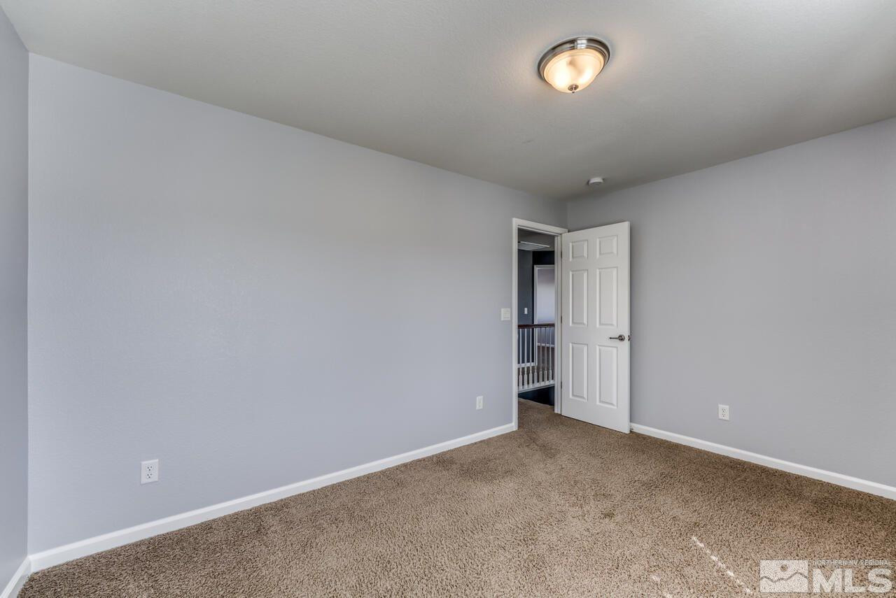 8935 Convair Way Reno, NV 89506 - Photo 31 of 39 a view of an empty room with a window