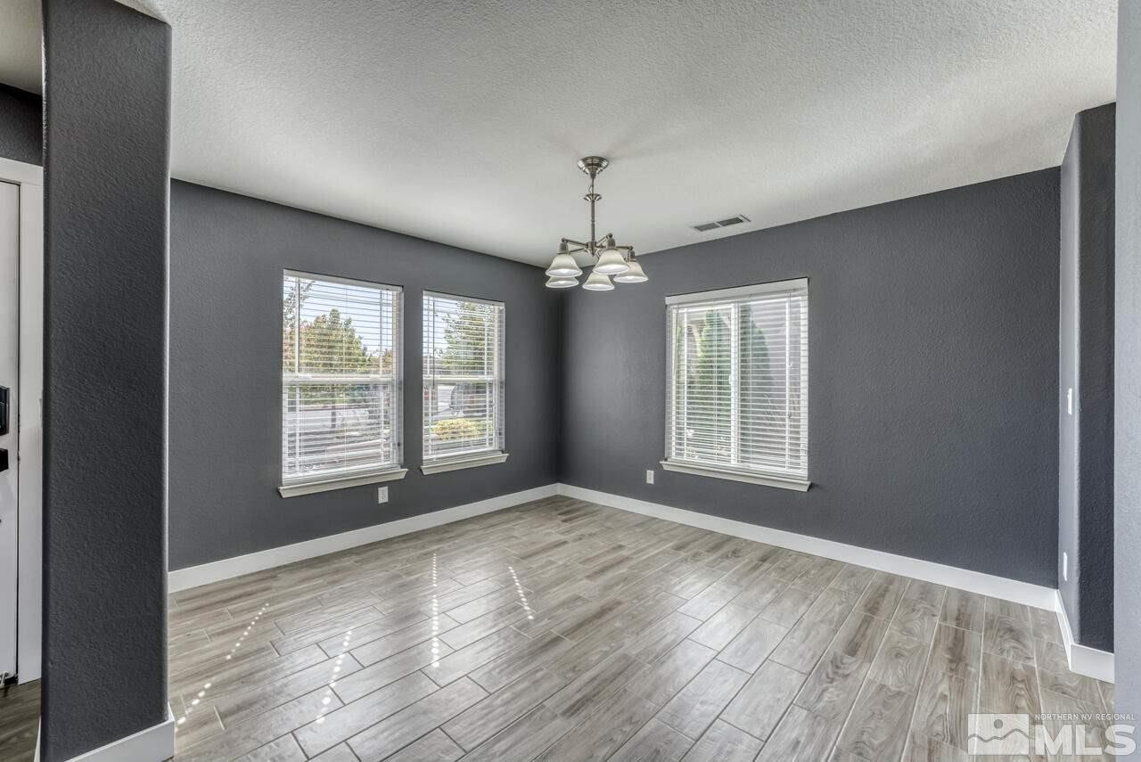8935 Convair Way Reno, NV 89506 - Photo 6 of 39 a view of livingroom with window hardwood floor and front door