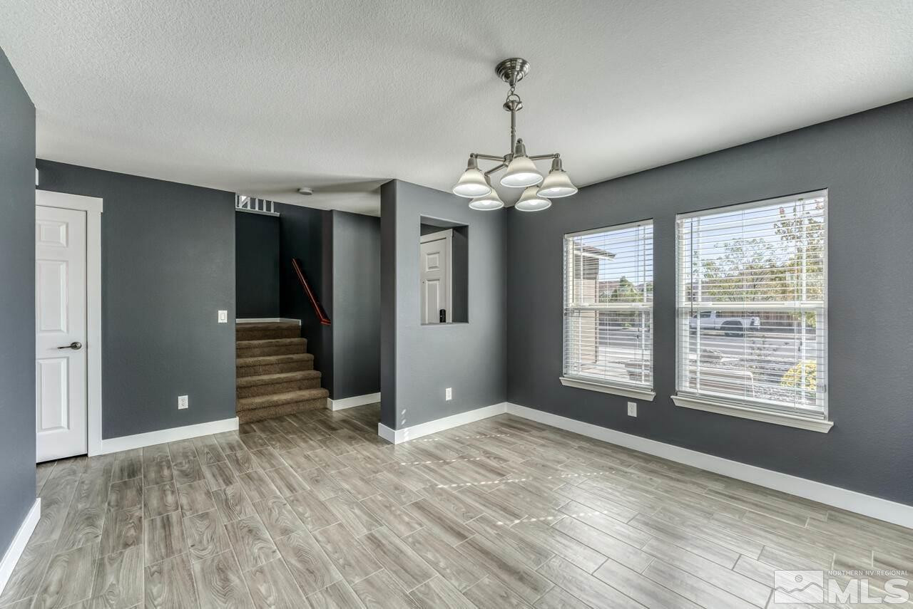 8935 Convair Way Reno, NV 89506 - Photo 9 of 39 a view of wooden floor and windows in a room