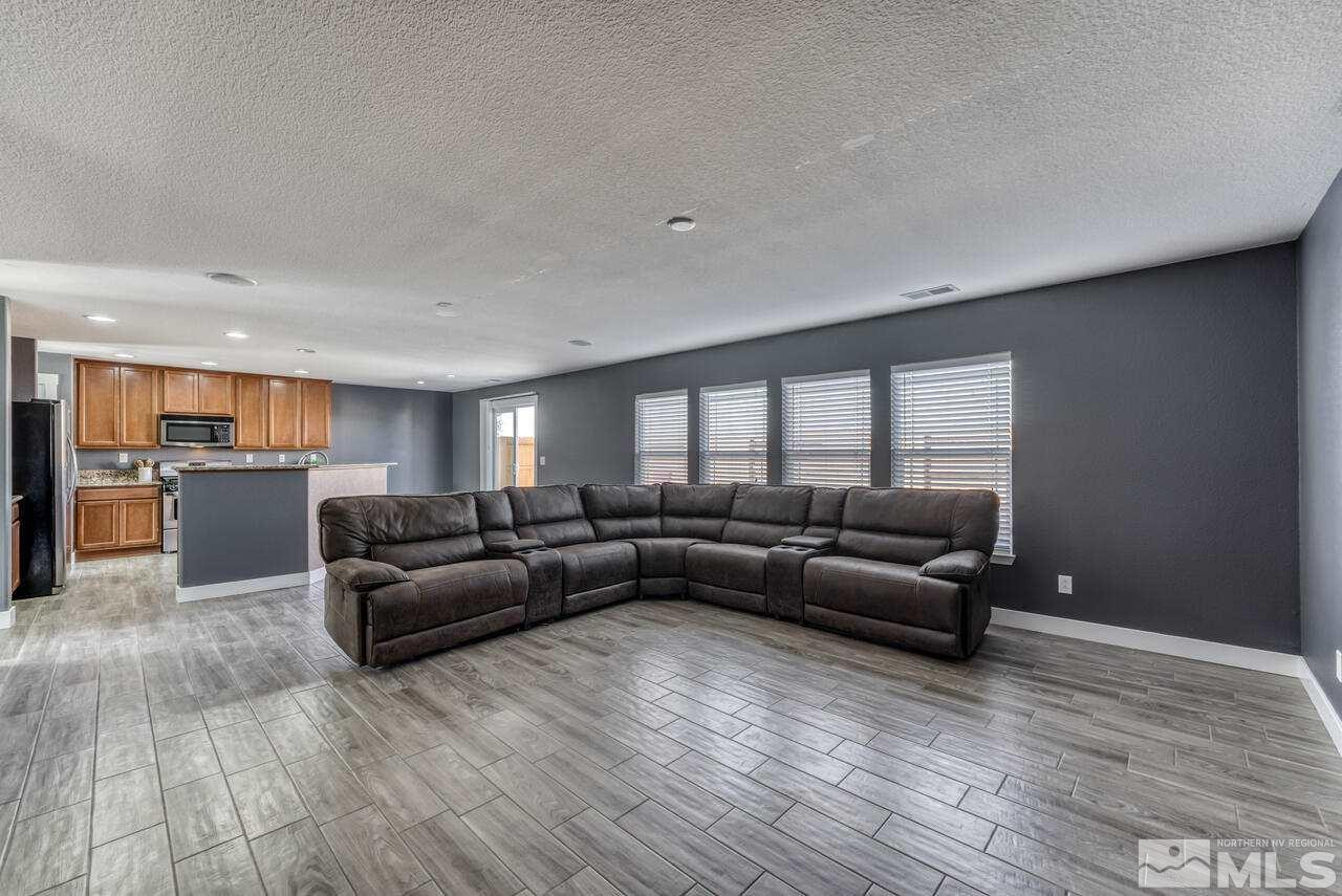 8935 Convair Way Reno, NV 89506 - Photo 10 of 39 a living room with furniture and hard wood flooring