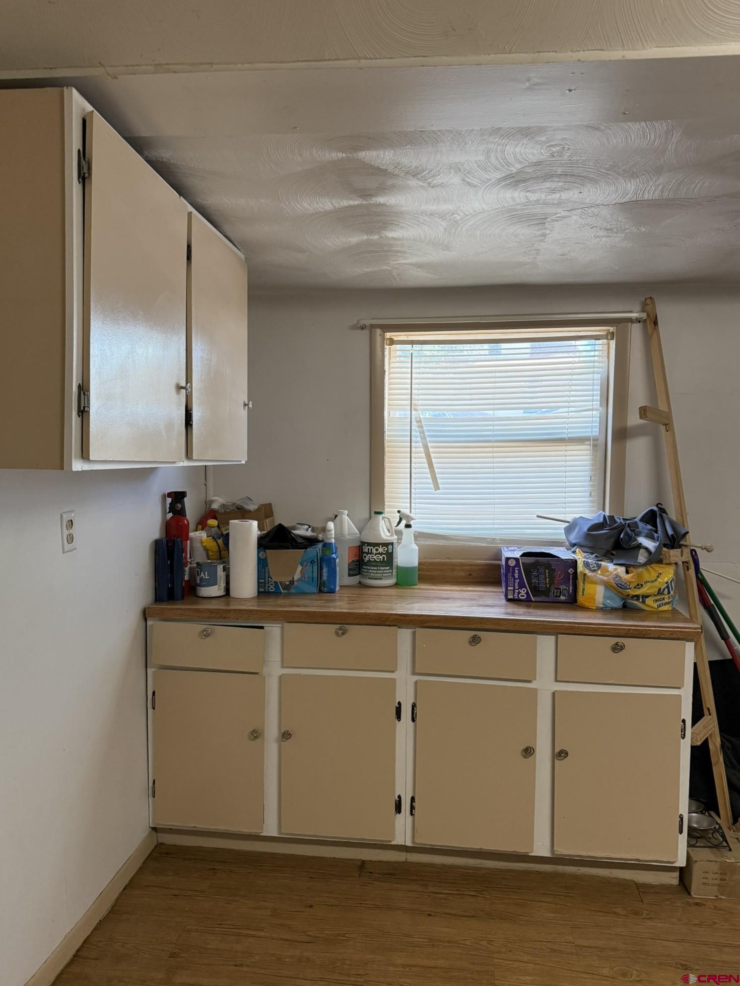311 West 3rd Street Delta, CO 81416 - Photo 12 of 24 a kitchen with a sink cabinets and window