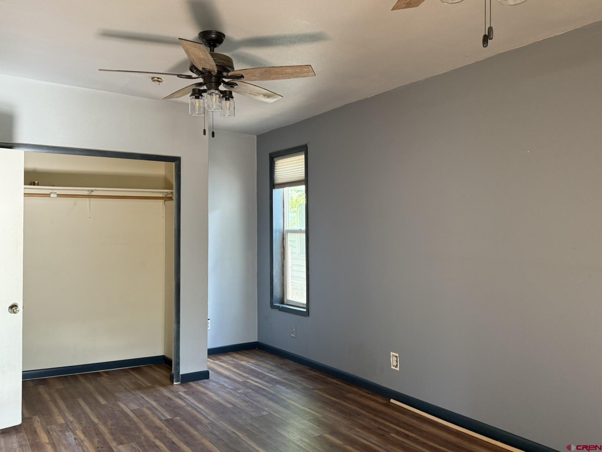 311 West 3rd Street Delta, CO 81416 - Photo 13 of 24 wooden floor in an empty room with a window