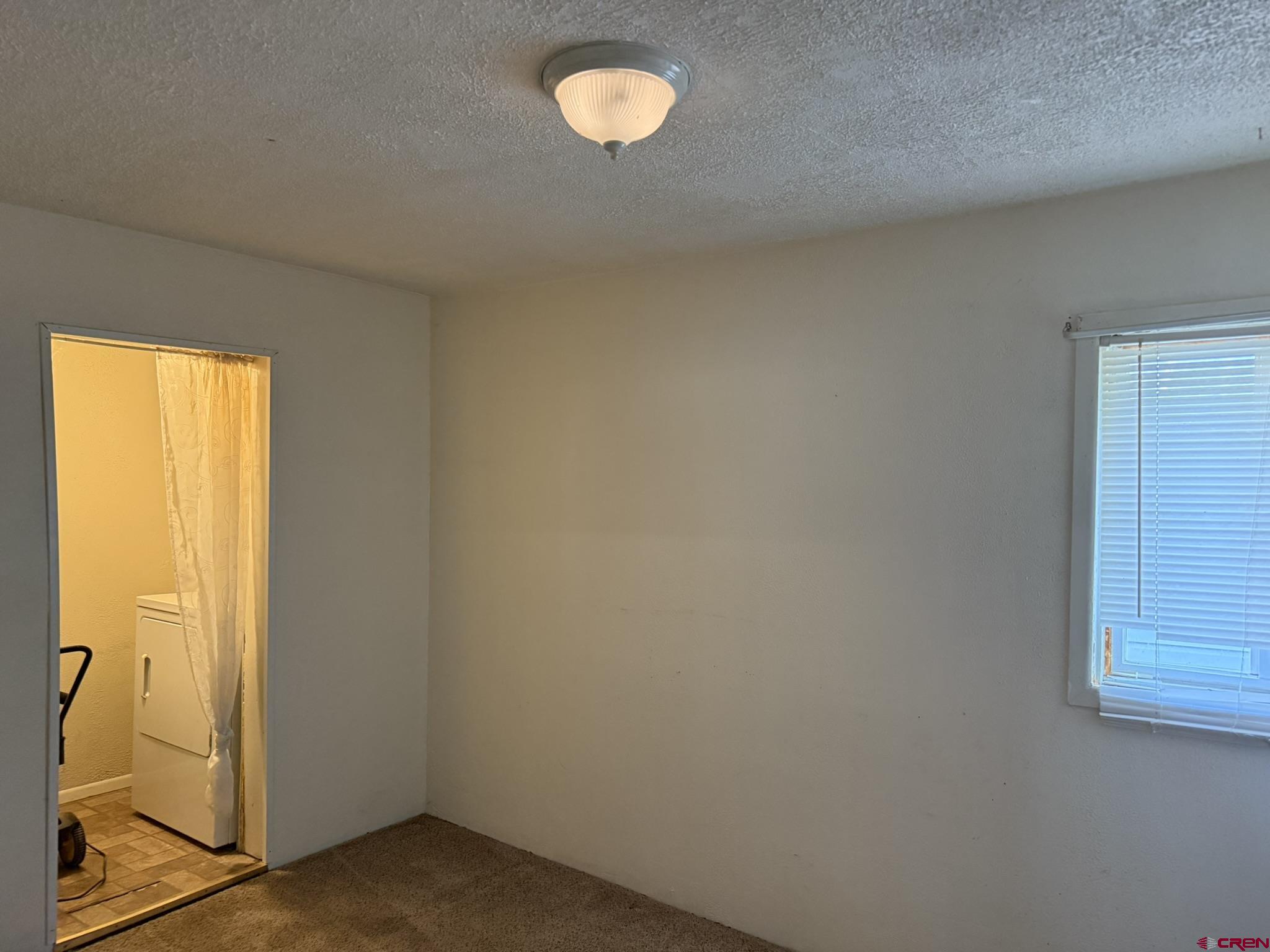 311 West 3rd Street Delta, CO 81416 - Photo 17 of 24 an empty room with window