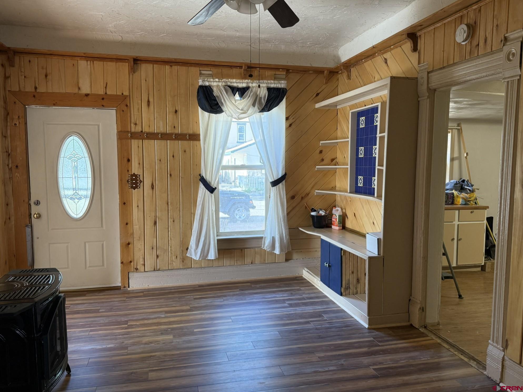 311 West 3rd Street Delta, CO 81416 - Photo 2 of 24 a large kitchen with a lot of wooden cabinets