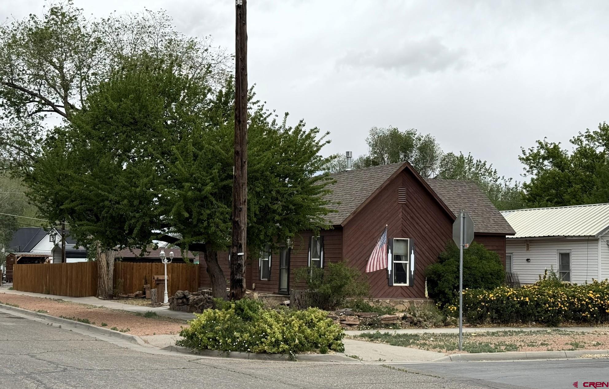311 West 3rd Street Delta, CO 81416 - Photo 21 of 24 a front view of a house with garden