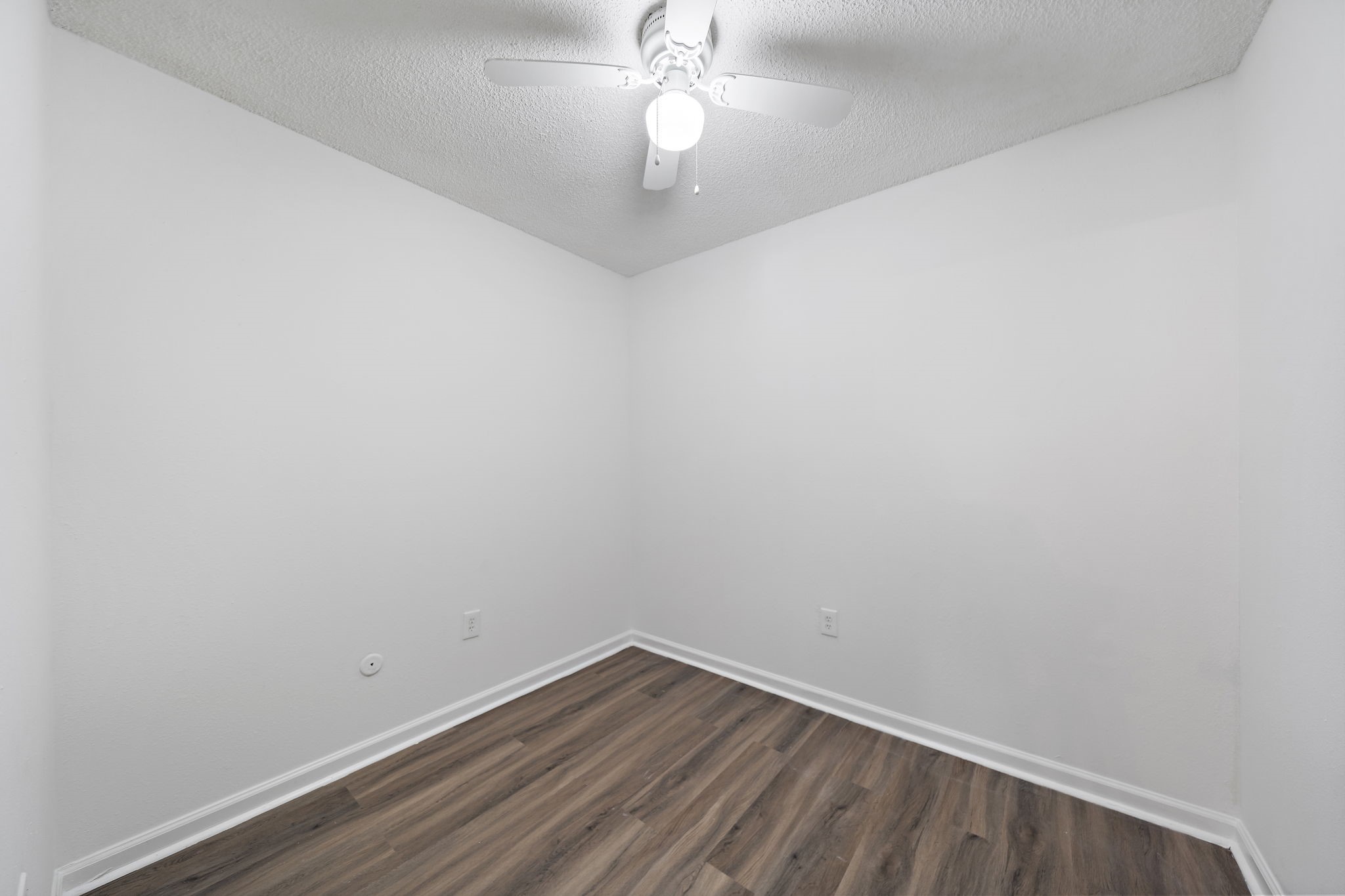 711 Holiday Drive, Unit 33 Galveston, TX 77550 - Photo 8 of 10 a view of an empty room with wooden floor