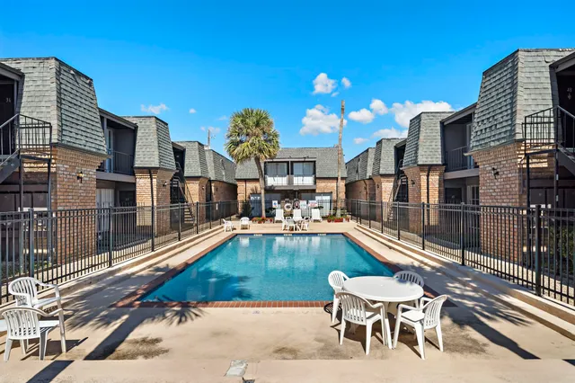 a view of a swimming pool with a lounge chairs