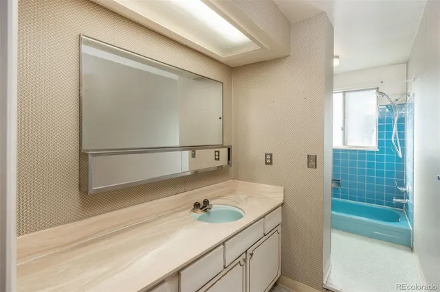 a bathroom with a sink and a mirror