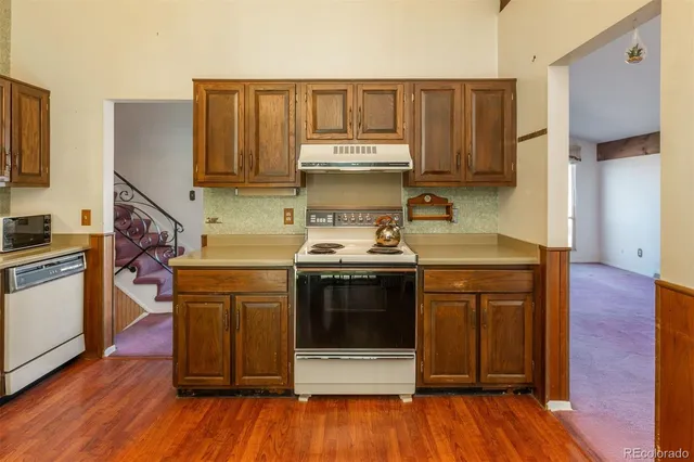 a kitchen with a stove and a microwave