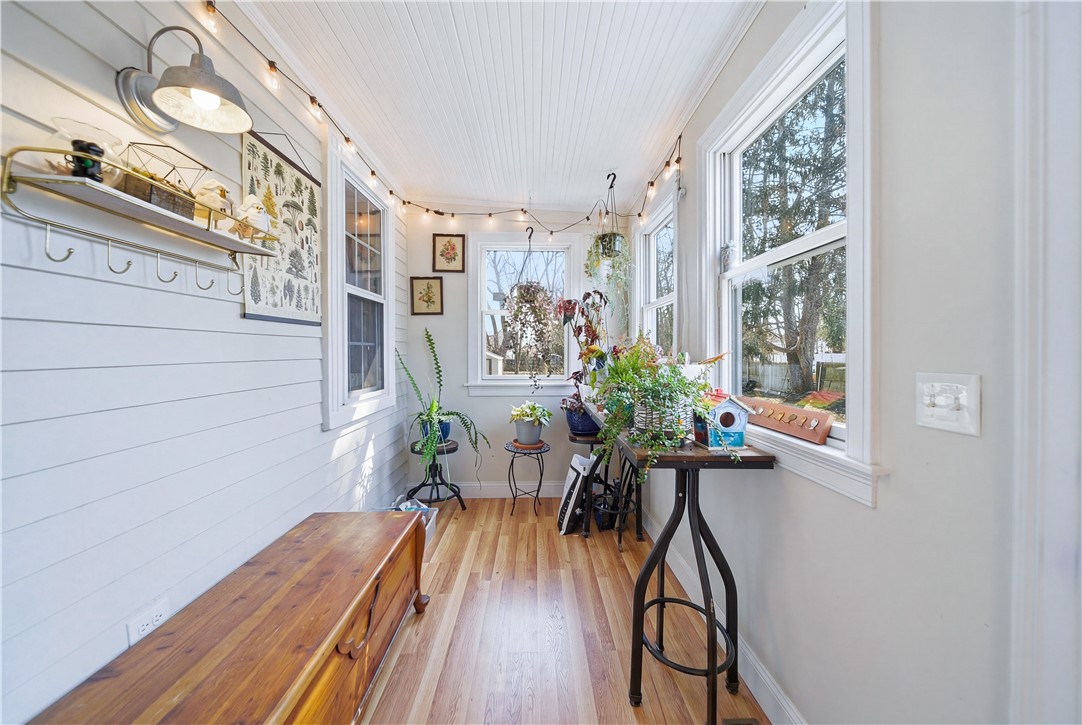 27 Barney Street Warren, RI 02885 - Photo 17 of 39 Enclosed porch serves as mudroom