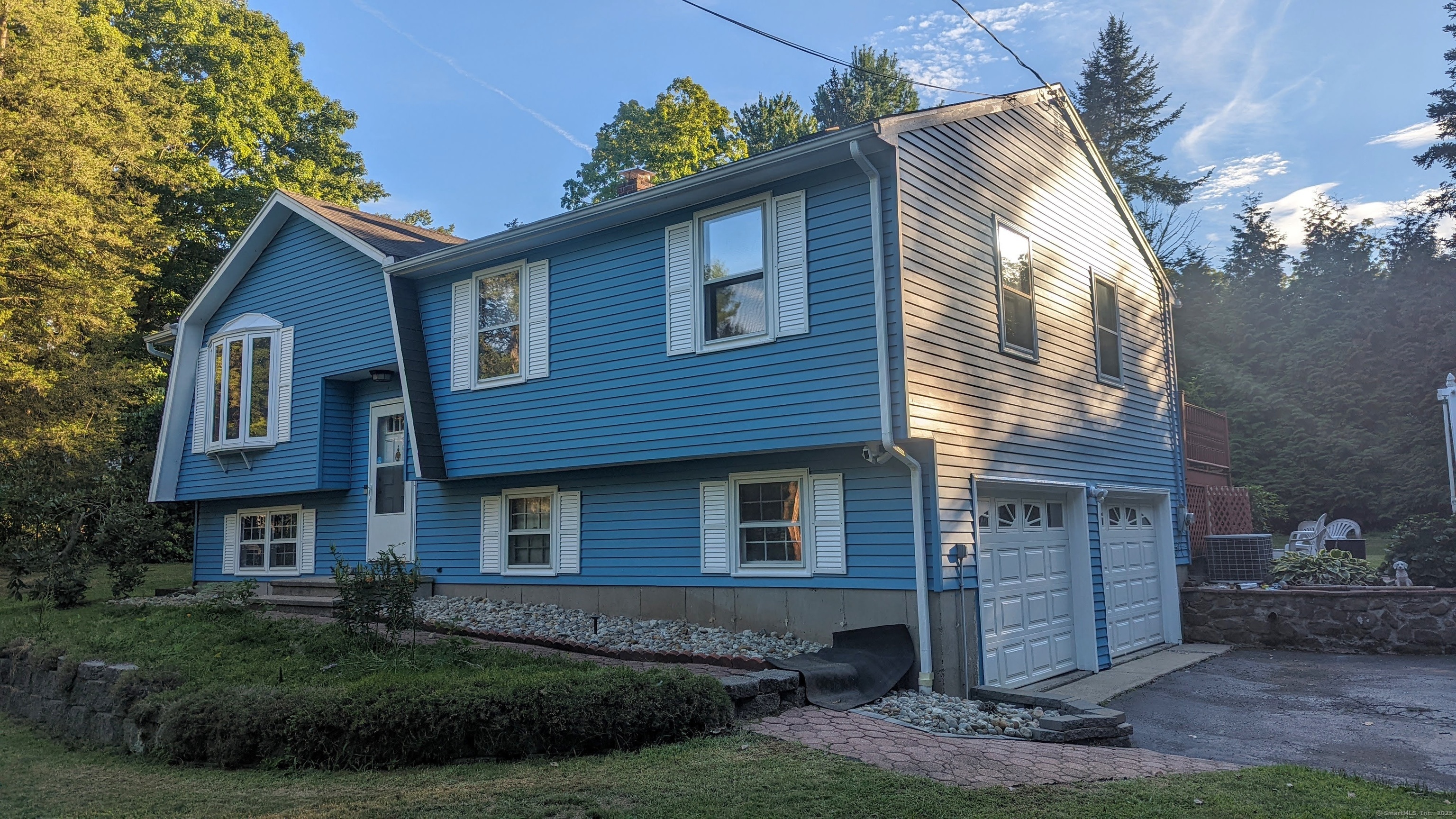 36 Bailey Avenue Wallingford, CT 06492 - Photo 1 of 26 a front view of a house with a garden