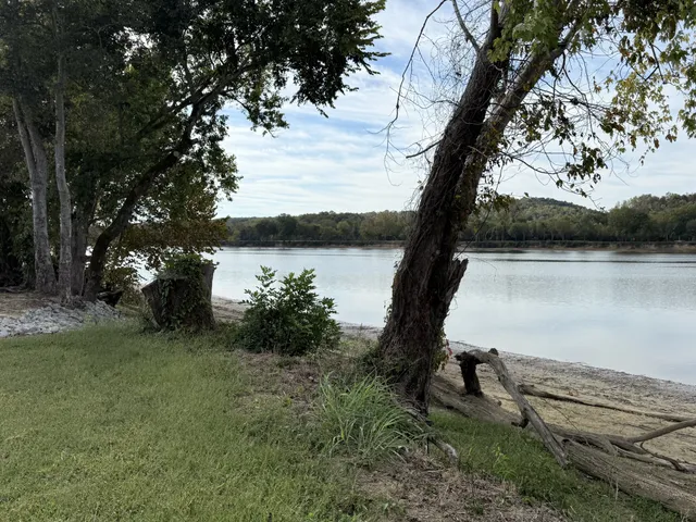 a view of a lake with a yard