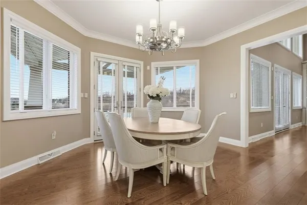 a kitchen with stainless steel appliances granite countertop a stove refrigerator sink and cabinets