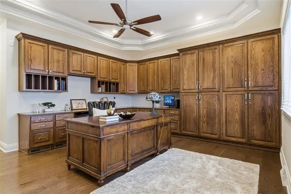 a spacious bedroom with a bed and a flat screen tv