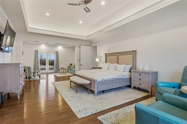 a spacious bathroom with a granite countertop sink a toilet and shower
